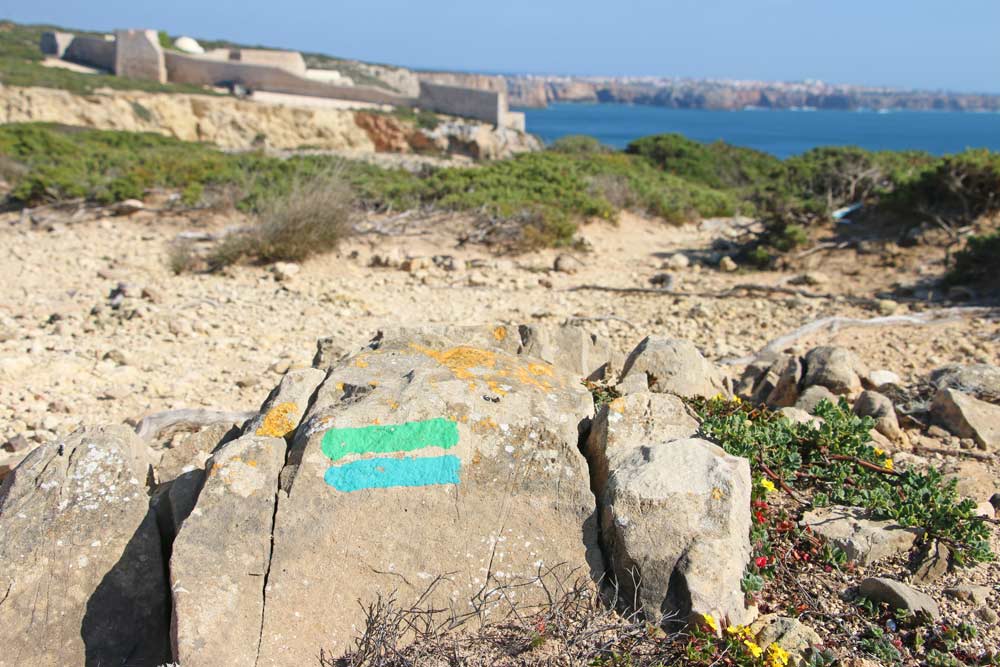 Route marking (blue & green stripes) on a rock on the Fishermen's Trail